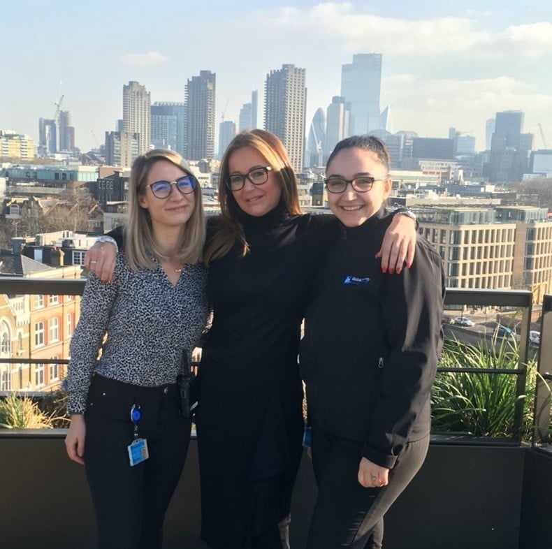 Director STARS Jacey Bloomberg standing with two Securitas STARS female officers.